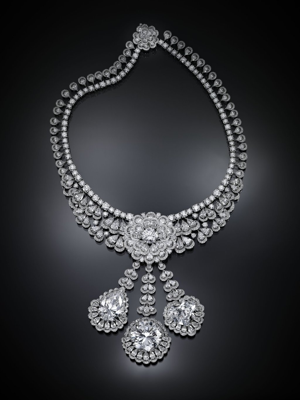 From Chopard's Garden of Kalahari collection. From the necklace dangles three remarkable D-flawless stones: a 25ct pear-shaped, 50ct brilliant-cut, and 26ct heart-shaped diamonds. The pear-shaped andheart-shaped diamonds can be detached and worn as earrings.