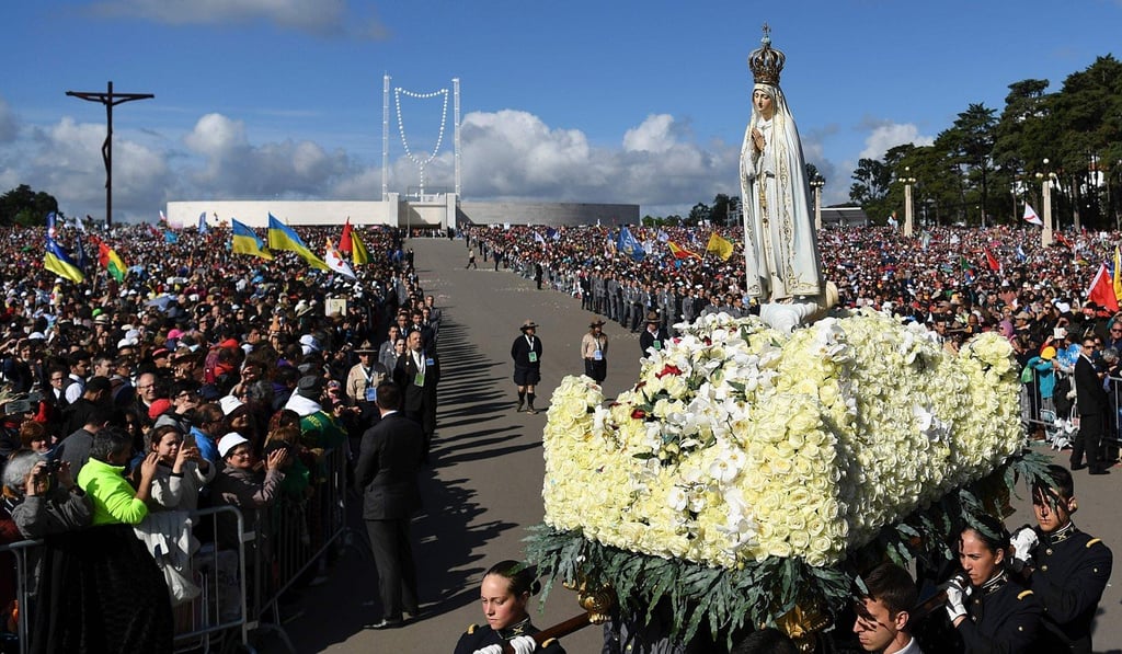 A figure representing Our Lady of Fatima is carried to the Chapel of Apparitions after a mass celebrated by Pope Francis at Fatima shrine. Photo: AFP A figure representing Our Lady of Fatima is carried to the Chapel of Apparitions after a mass celebrated by Pope Francis at Fatima shrine. Photo: AFP
