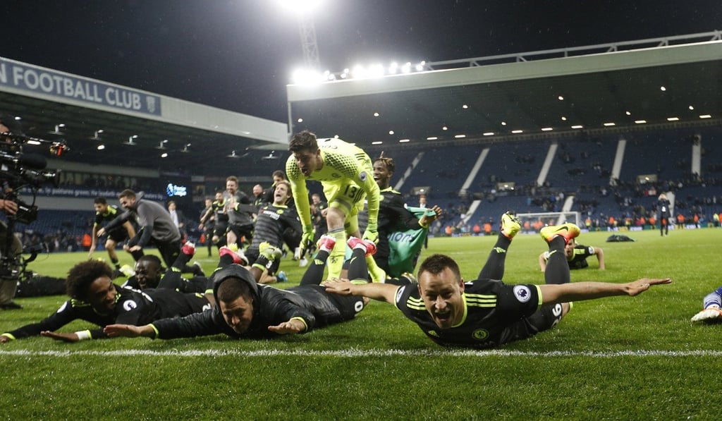 Chelsea’s John Terry, Asmir Begovic and Eden Hazard celebrate with teammates after winning the Premier League title. Photo: Reuters