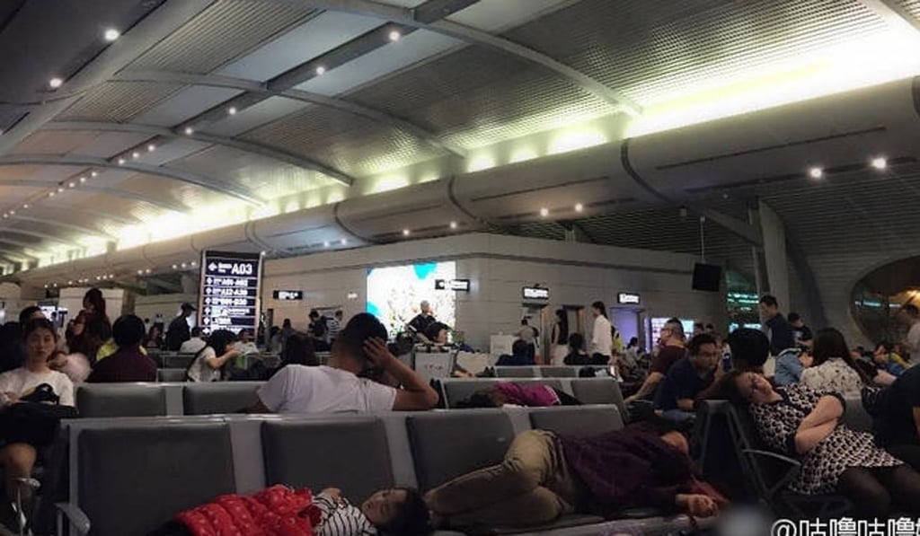 More than 10,000 travellers were left stranded after flight operations were disrupted by drones at the international airport in Chongqing on Friday night. Photo: Handout
