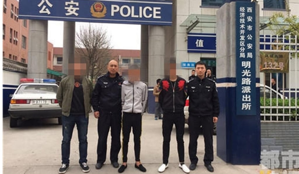 Police in Xian parade three gang members. Photo: Handout Police in Xian parade three gang members. Photo: Handout