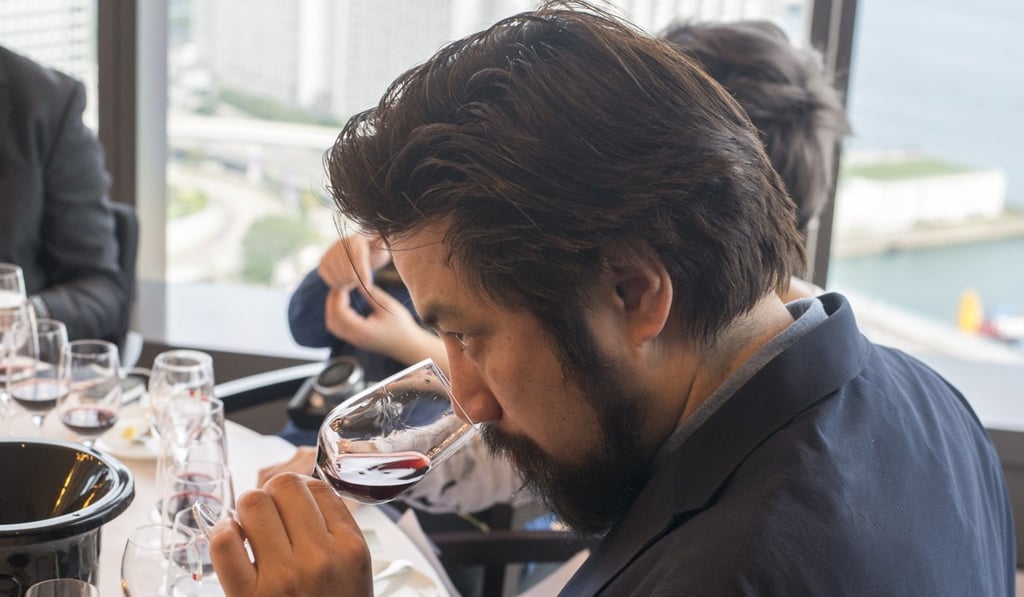 A man smells a glass of wine at the Asian Wine Festival press preview in Hotel Icon in Tsim She Tsui in March. Photo: Handout