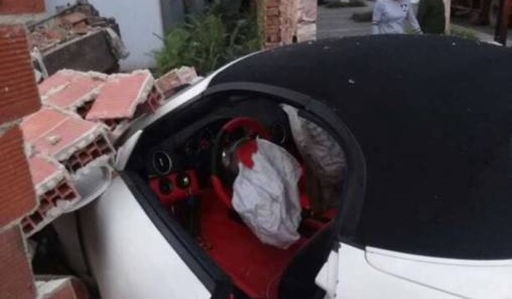 The Porsche tried to avoid the Ferrari in front and slammed into a brick wall. Photo: Handout