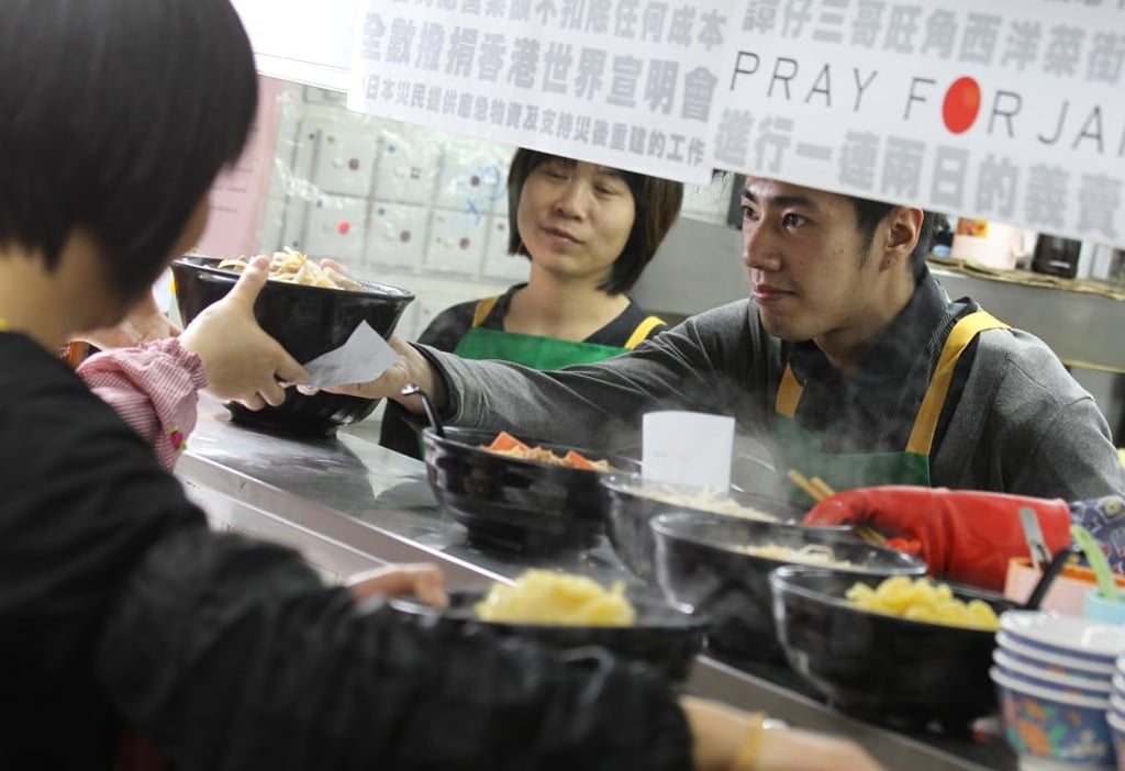 Eric Tam, 27, son of the owner of Tam's Yunnan Rice Noodles, helped out in its Mong Kok shop, which donated all its incomes on March 26 and 27, 2011, to World Vision's relief work in Japan. Photo: Dickson Lee