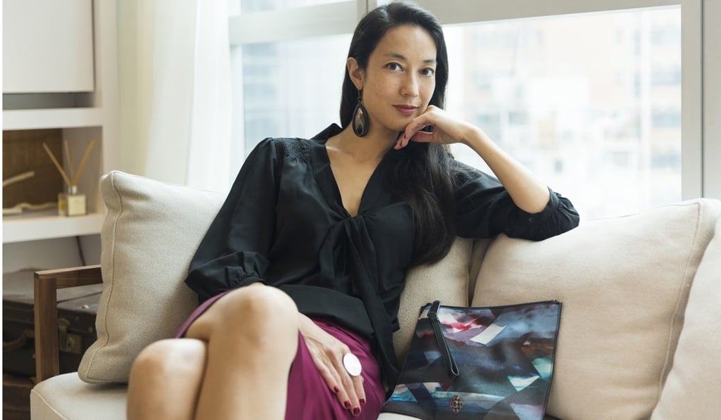 Top from Zara, skirt by Emporio Armani, ring from a shop in Bali and clutch by Rafe New York. Photo: Michelle Wong
