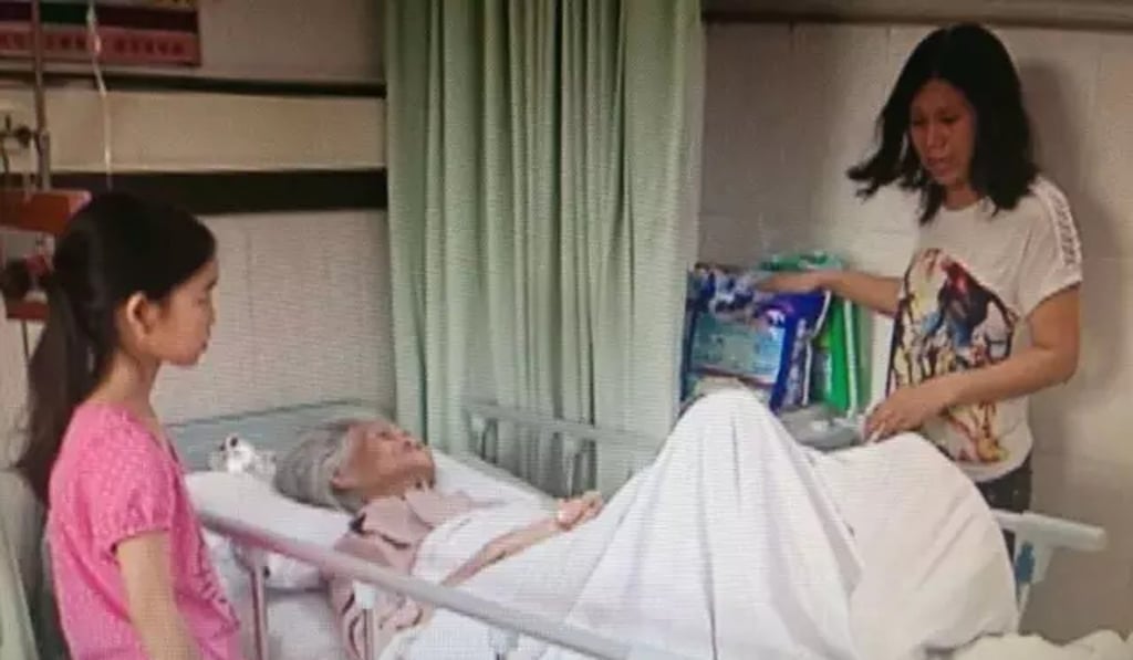 Zhang’s younger daughter and granddaughter visit her in hospital. Photo: Handout