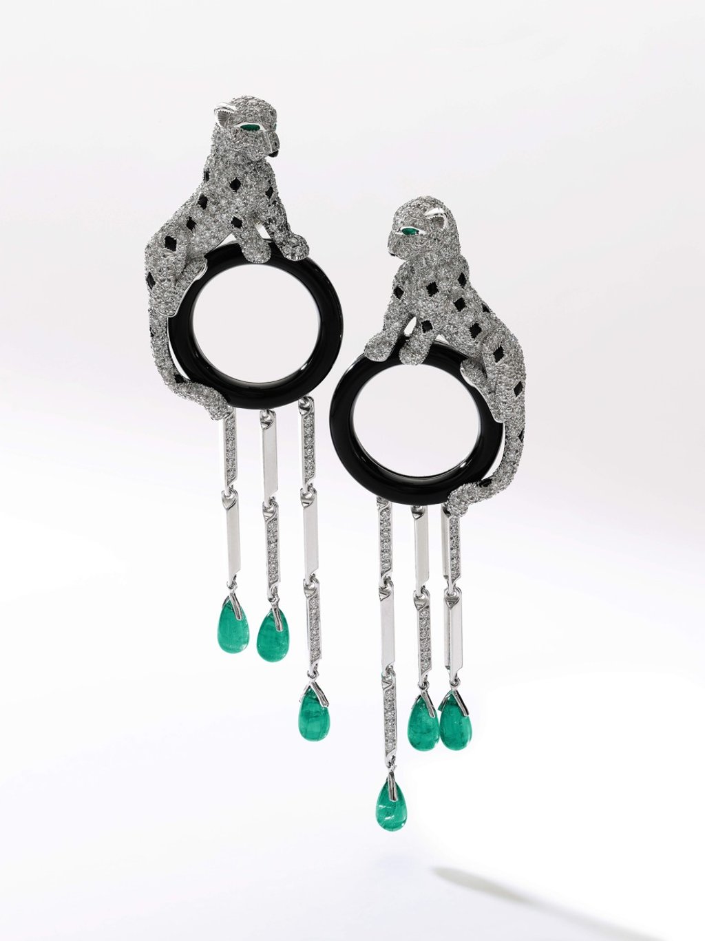 A pair of emerald, onyx and diamond earrings by Cartier goes on auction at Sotheby's sale of Magnificent Jewels and Noble Jewels