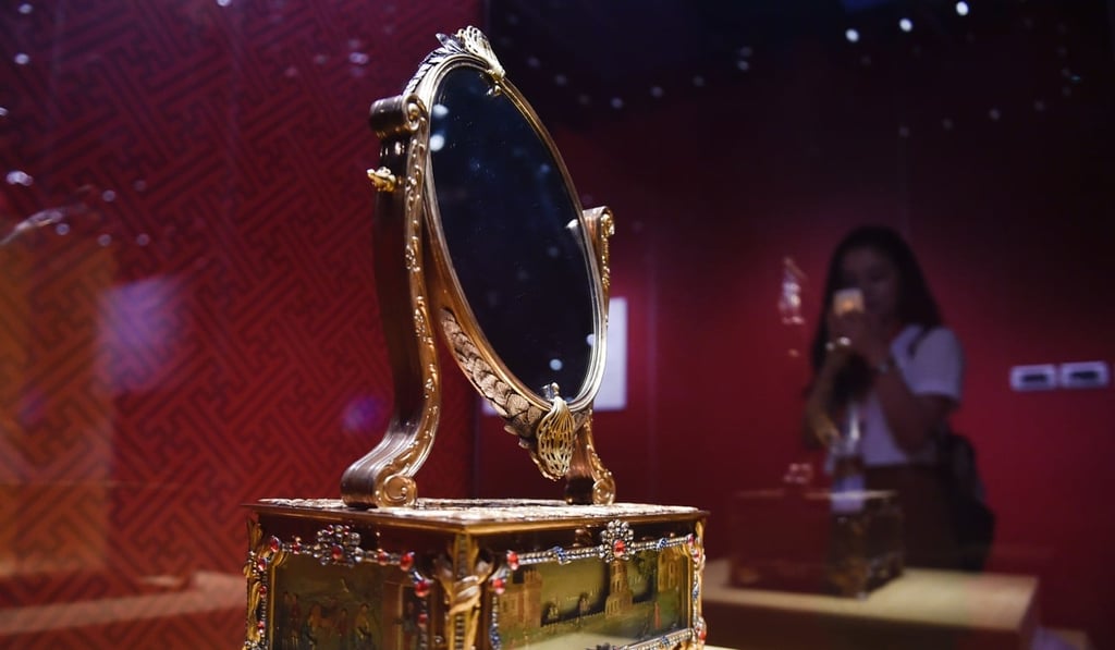 A gold-plated mirror from Britain is part of the collection. Photo: Xinhua