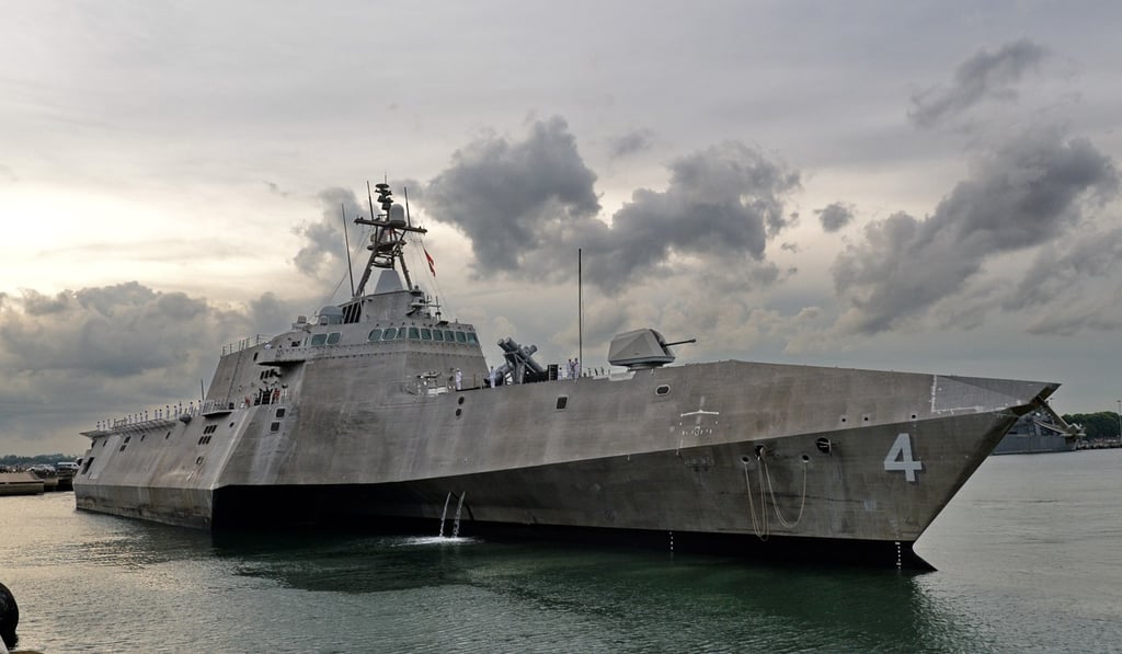 The USS Coronado (LCS 4) is guided by pilot boats (unseen) as she docks at Changi Naval Base in Singapore. The two countries are close allies, as Singapore is buying two submarines to boost the strength of its navy. Photo: AFP