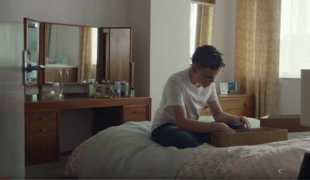 The young star of the yanked McDonald's ad goes through his late father's belongings, at the start of his journey of discovery of their shared love of Filet-O-Fish burgers. Photo: YouTube