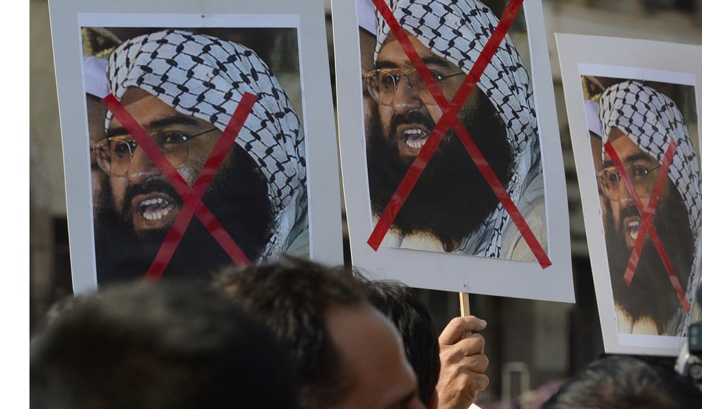 Indian activists hold up posters of Masood Azhar as they protest against the attack two days before on an air force base in Pathankot, believed to have been masterminded by the Jaish-e-Mohammed chief, in Mumbai on January 4. Photo: AFP