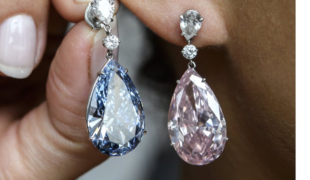 A closer look at the Apollo Blue and the Artemis Pink diamond earrings. Photo: EPA A closer look at the Apollo Blue and the Artemis Pink diamond earrings. Photo: EPA