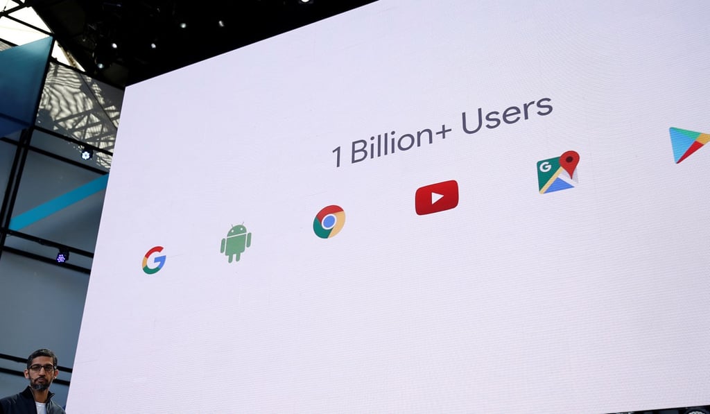 Google CEO Sundar Pichai speaks on stage during the annual Google I/O developers conference in San Jose, California, showing the number of users of its services. Photo: Reuters