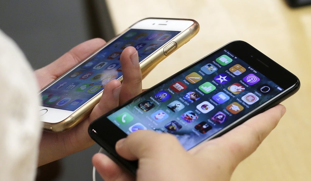 A pair of Apple’s iPhones as the company’s manfuacturers are embroiled in a lawsuit against chipmaker Qualcomm. Photo: AP A pair of Apple’s iPhones as the company’s manfuacturers are embroiled in a lawsuit against chipmaker Qualcomm. Photo: AP