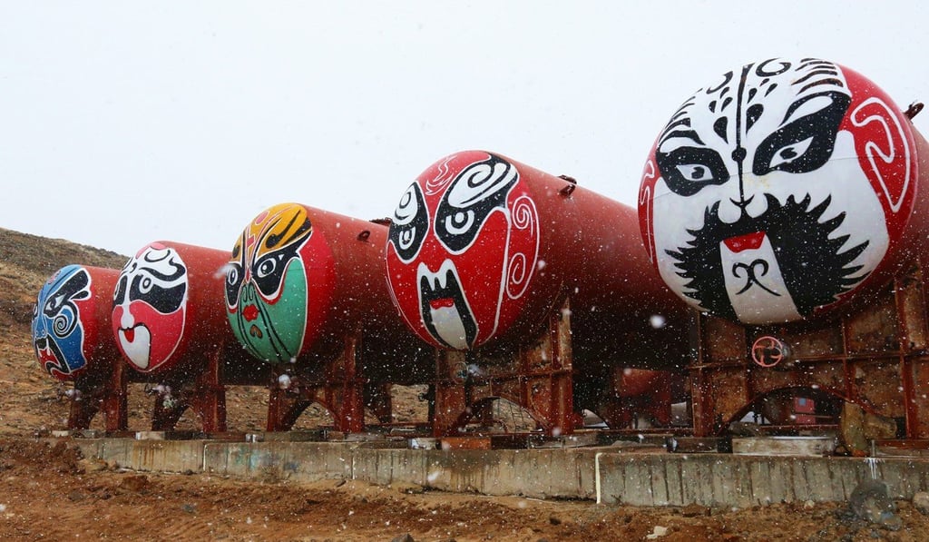 Peking Opera masks on oil tanks underline the Chinese presence at Zhongshan Station, one of China’s scientific research bases in Antarctica, in March 2015. Photo: Xinhua