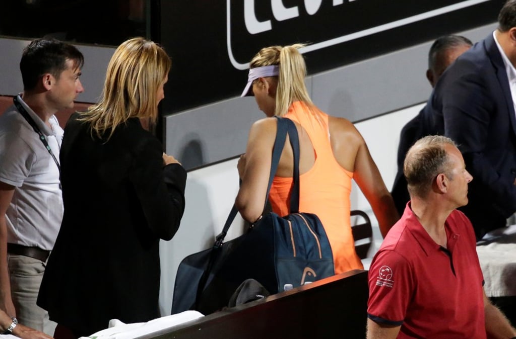 Maria Sharapova leaves the court in the third set of her match with Mirjana Lucic-Baroni in Rome because of injury. Photo: Reuters