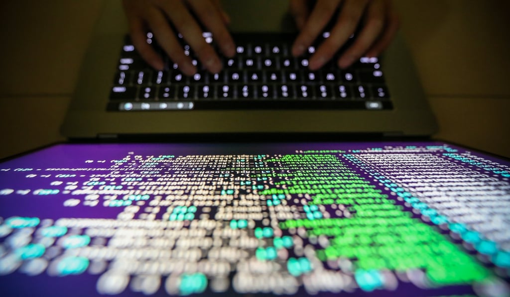 A programmer shows a sample of decrypting source code in Taipei, Taiwan. Photo: EPA
