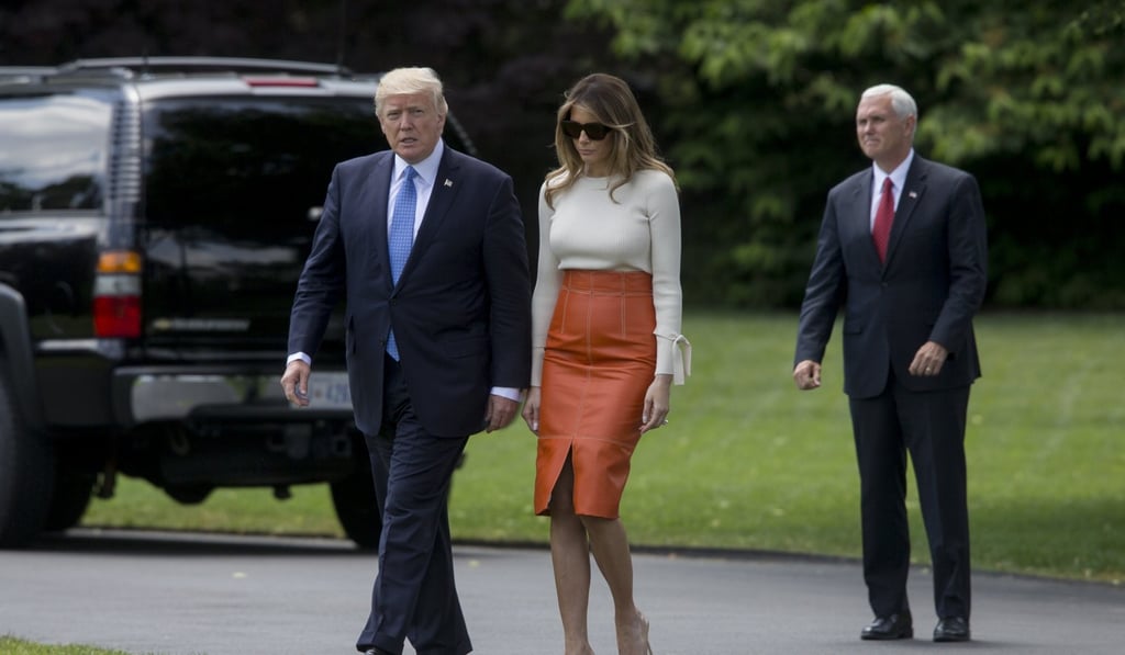 US President Donald Trump and first lady Melania before departing. Photo: EPA