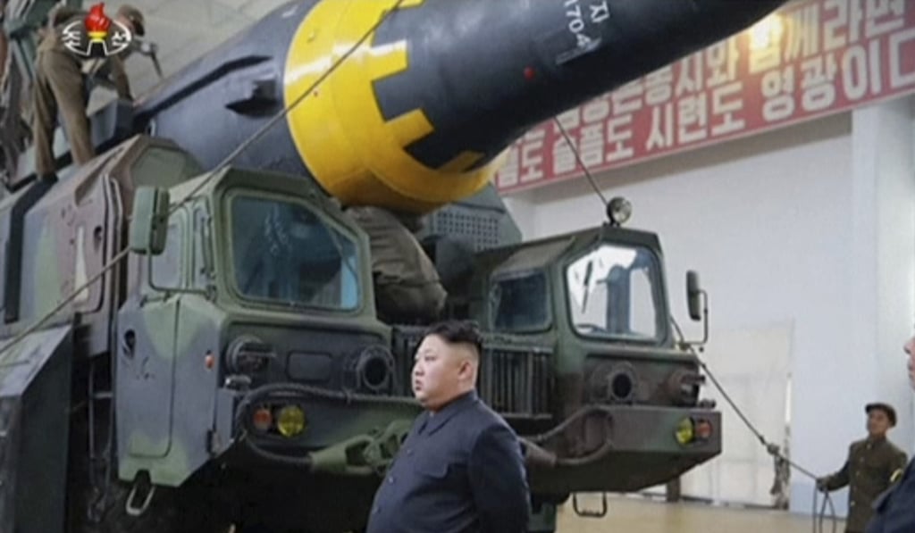 Kim Jong-un at what was said to be a missile test site at an undisclosed location in North Korea. Photo: AP Kim Jong-un at what was said to be a missile test site at an undisclosed location in North Korea. Photo: AP