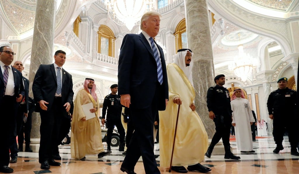 US President Donald Trump walks with Saudi Arabia’s King Salman. Photo: Reuters