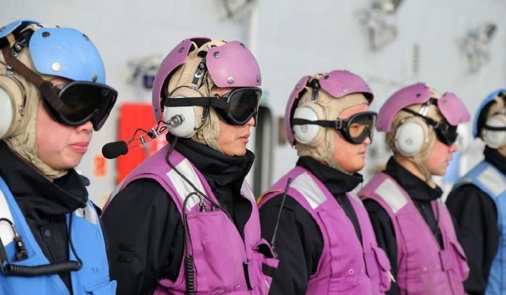Flight deck crew members in their colourful garb. Photo: SCMP Pictures
