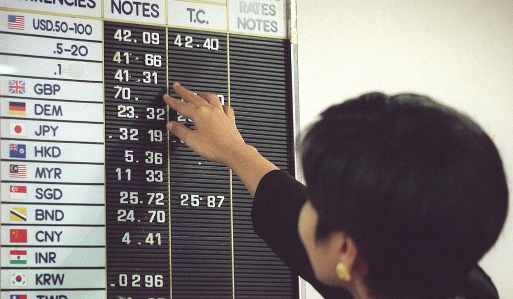 Thai authorities floating the baht precipitated an immediate 20 per cent devaluation. Photo: AFP Thai authorities floating the baht precipitated an immediate 20 per cent devaluation. Photo: AFP