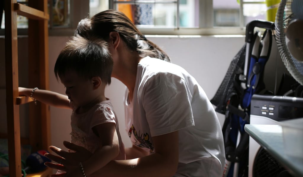 A mother and child at home in a subdivided flat in Sham Shui Po. Providing support to parents so they can find work will not only give a lift to the children immediately, but it is also very effective in tackling intergenerational poverty. Photo: Edward Wong