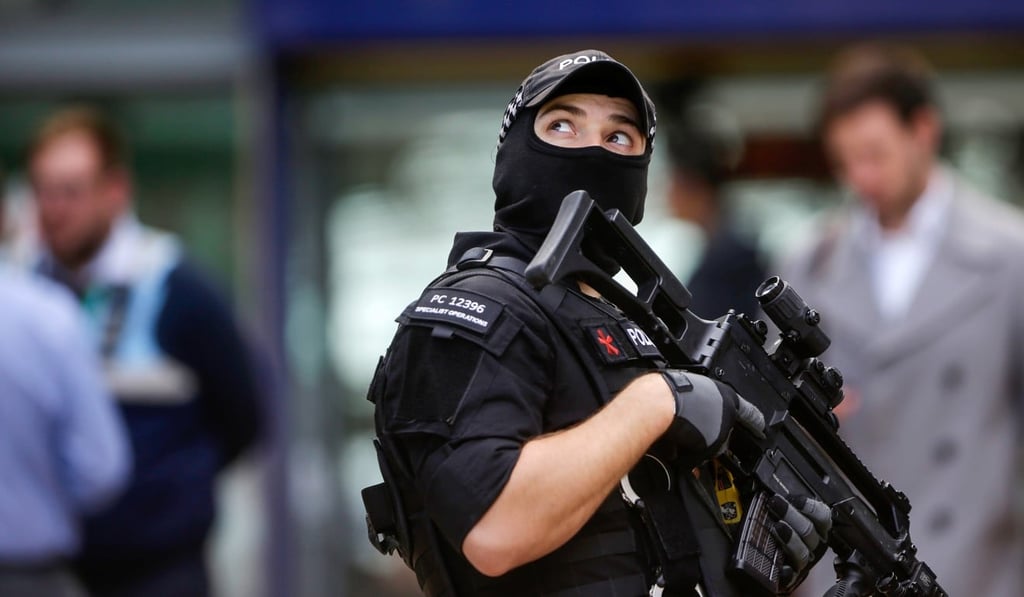 An armed police officer at Manchester Piccadilly railway station. Photo: Bloomberg