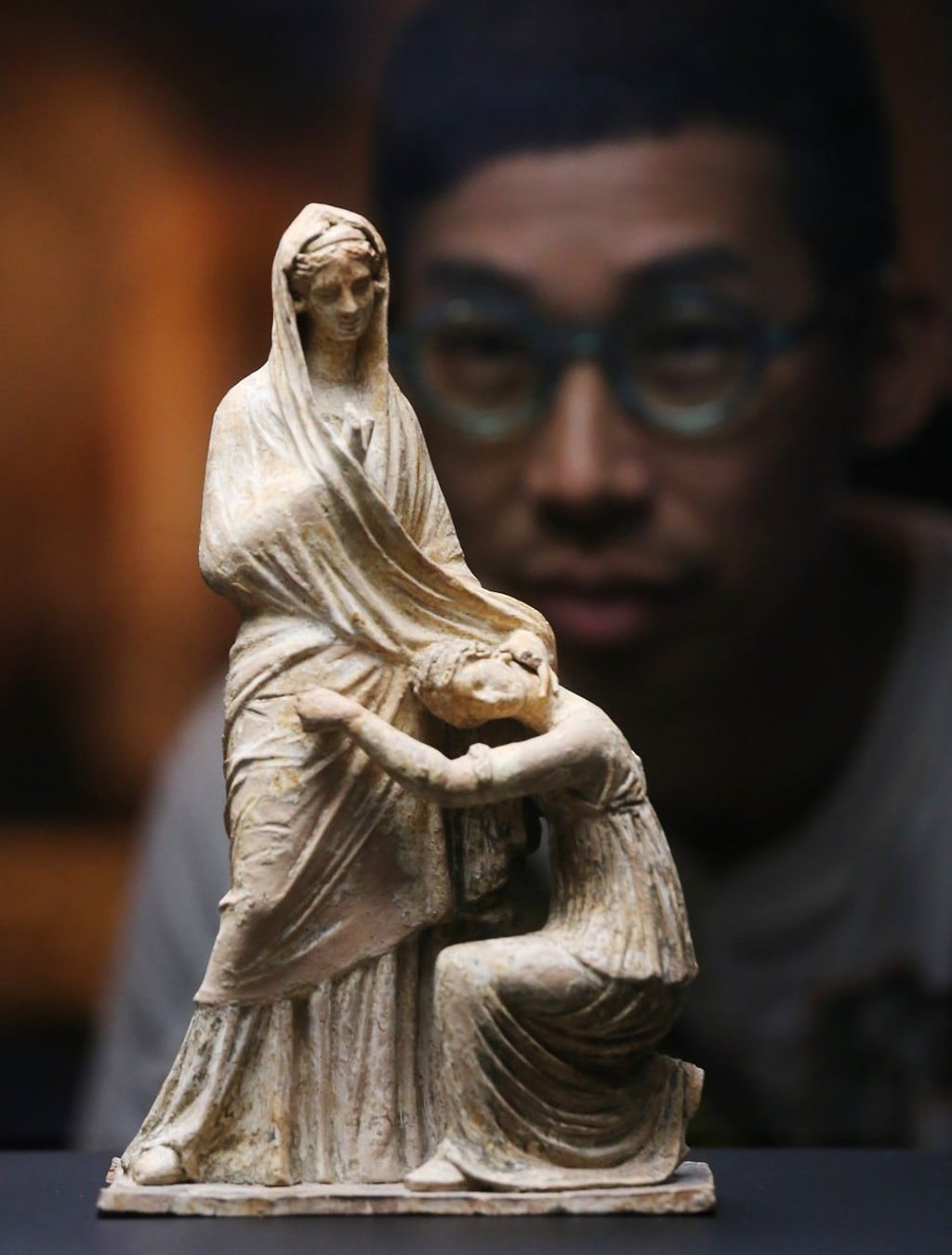 Figurine of‘Woman and Kneeling Girl, from 325-250BC, discovered in Tomb A, Myrina (Turkey), in 1883. Photo: Dickson Lee