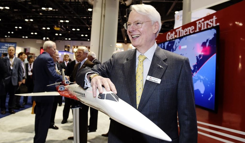 Robert Bass stands with a model of a planned supersonic business jet in 2014. Photo: Bloomberg