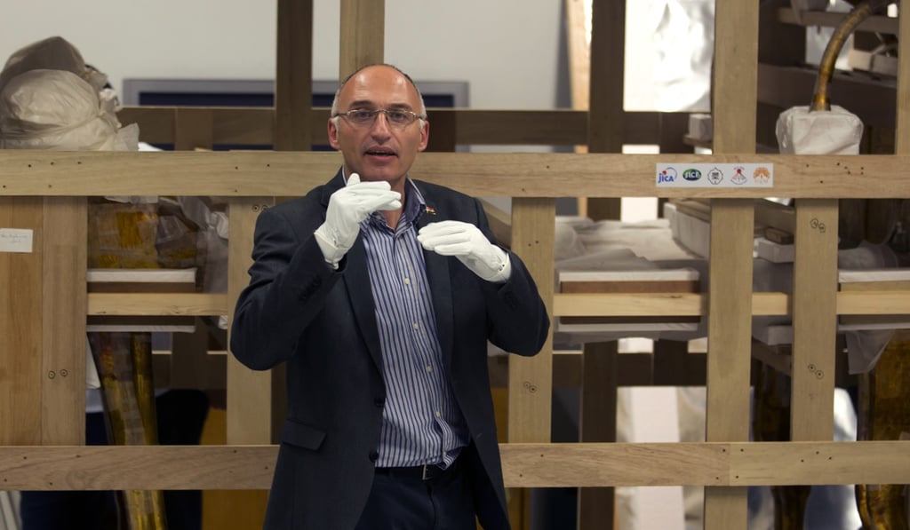 Tarek Tawfik, director of the Grand Egyptian Museum, speaks to reporters in front of king Tutankhamun's funerary bed upon its arrival at the Grand Egyptian Museum in Cairo, Egypt. Photo: AP