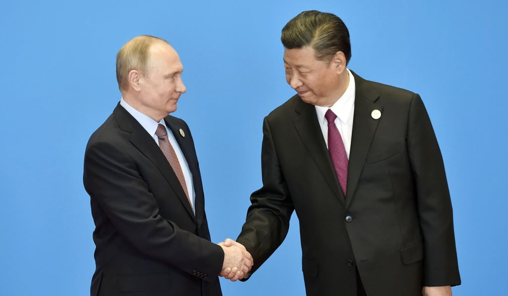 Russian President Vladimir Putin and his Chinese counterpart Xi Jinping shake hands in Beijing on May 15 during a summit on the Belt and Road Initiative. The Trump administration believes the bromance between the two is just a facade. Is it? Photo: Kyodo