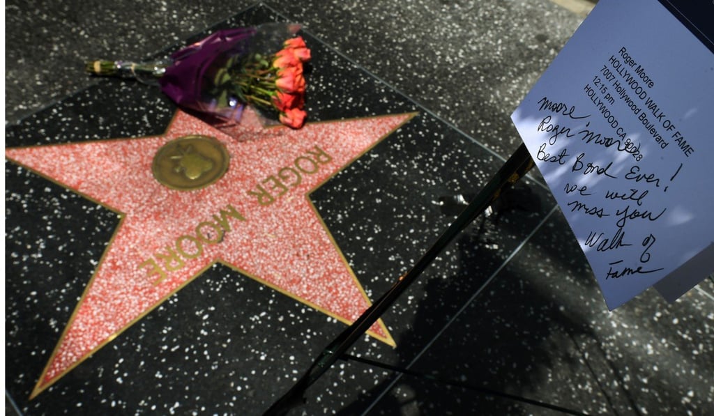 Flowers are placed on the Hollywood Walk of Fame star of actor Roger Moore on May 23, 2017. Photo: AFP