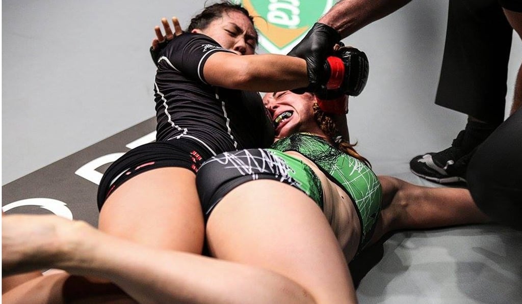 Angela Lee (left) submits Natalie Gonzales Hills with a rare twister hold in their fight in Singapore in 2015. Photo: ONE Championship