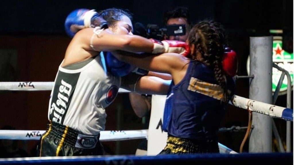 Kang in action in her debut muay thai bout. Photo: Facebook (Malcolm Wood) Kang in action in her debut muay thai bout. Photo: Facebook (Malcolm Wood)