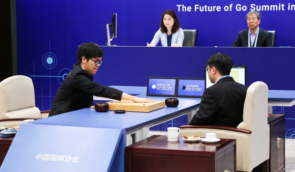 Chinese Go player Ke Jie places a stone against Google's artificial intelligence programme AlphaGo during their second match. Photo: Reuters