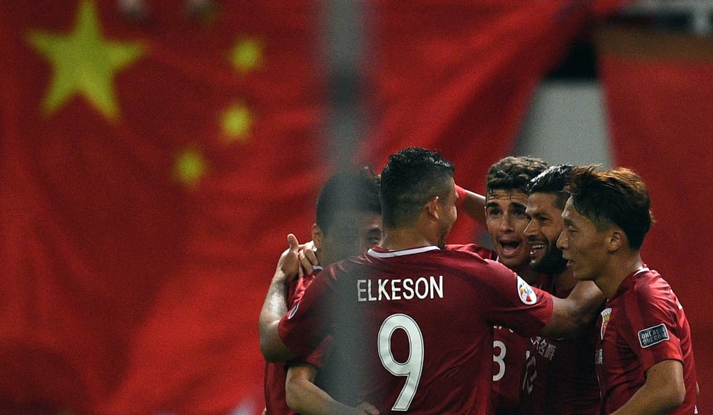 Shanghai SIPG’Brazilian forward Hulk celebrates with fellow big-money foreigners Oscar and Elkeson in a recent game. Photo: AFP