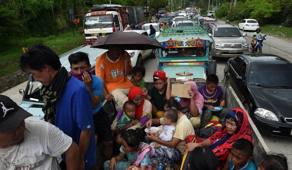 Resident flee Marawi city, where gunmen who had declared allegiance to Islamic State went on the rampage. Photo: AFP Photo