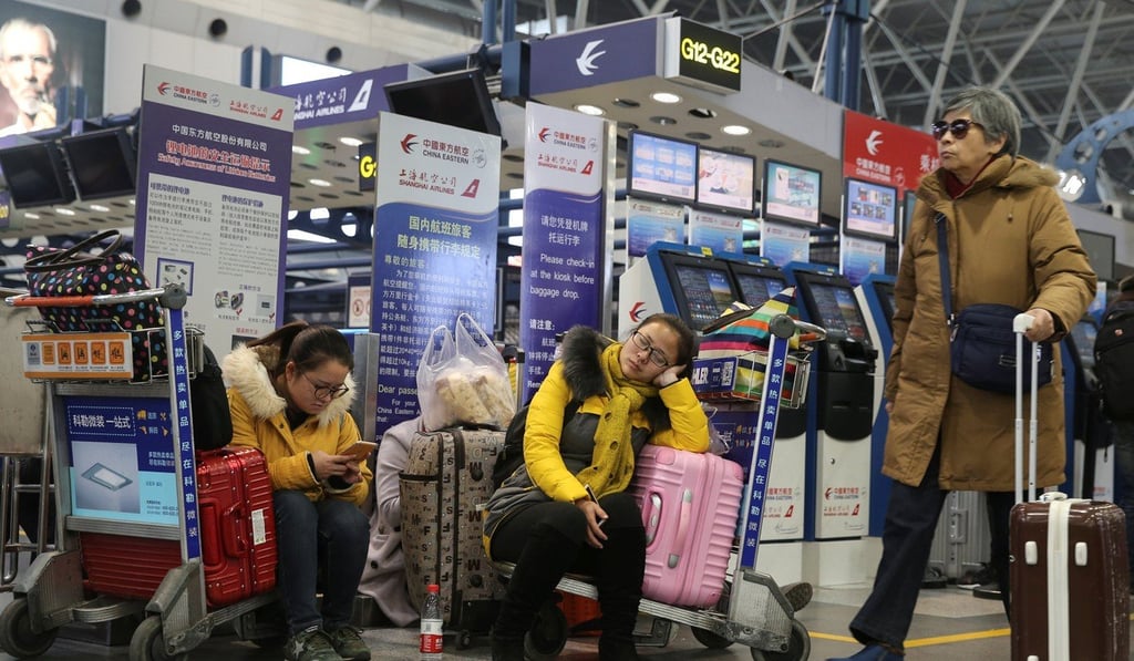 Passengers hit by flight delays at Beijing Capital International Airport in December last year. Photo: Reuters
