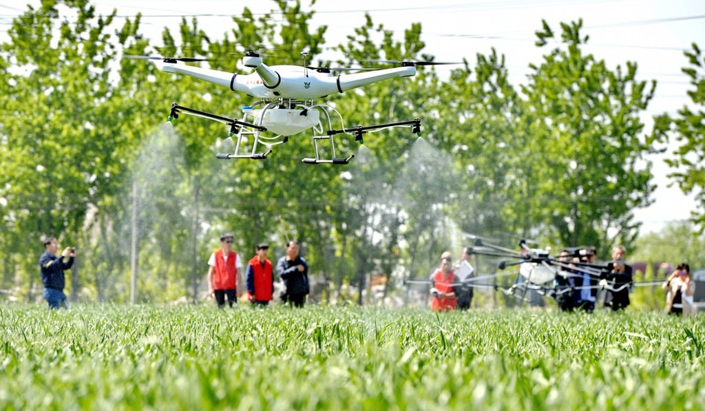 A drone takes over the job of spraying pesticide in a wheat field in Longyao county in Xingtai city, Hebei province, last month. China has surprised many by building world-leading positions in civilian drones in a short time. Photo: Xinhua