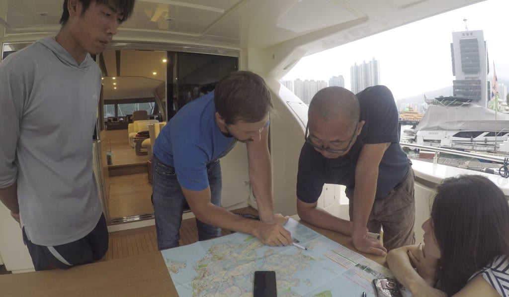 Paul Niel discussies the route with Captain Wah on Monday. Photo: Michael Sakas. Paul Niel discussies the route with Captain Wah on Monday. Photo: Michael Sakas.