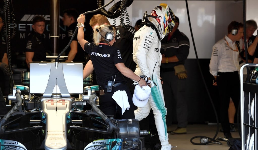Mercedes' Lewis Hamilton steps out of his car during qualifying. Photo: Reuters