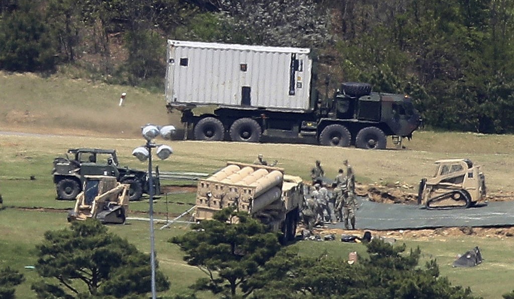 U.S. Army soldiers install the Terminal High-Altitude Area Defense missile defense system at a golf course in Seongju, South Korea. Photo: AP Photo