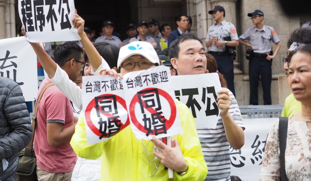 Activists opposed to same-sex marriage protest outside the Judicial Yuan in Taipei, on May 24. Achieving legislative consensus to apply the constitutional court’s ruling within the stipulated two years will be a challenge for Taiwan’s political leaders. Photo: EPA Activists opposed to same-sex marriage protest outside the Judicial Yuan in Taipei, on May 24. Achieving legislative consensus to apply the constitutional court’s ruling within the stipulated two years will be a challenge for Taiwan’s political leaders. Photo: EPA