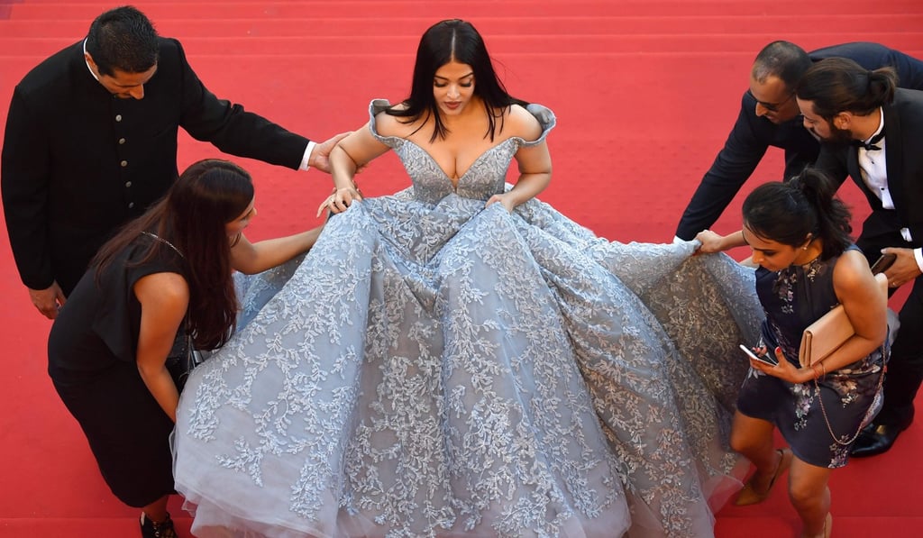 Aishwarya Rai Bachchan arrives for the screening of Okja is a gown so big she needed five assistants to help. Photo: AFP Aishwarya Rai Bachchan arrives for the screening of Okja is a gown so big she needed five assistants to help. Photo: AFP