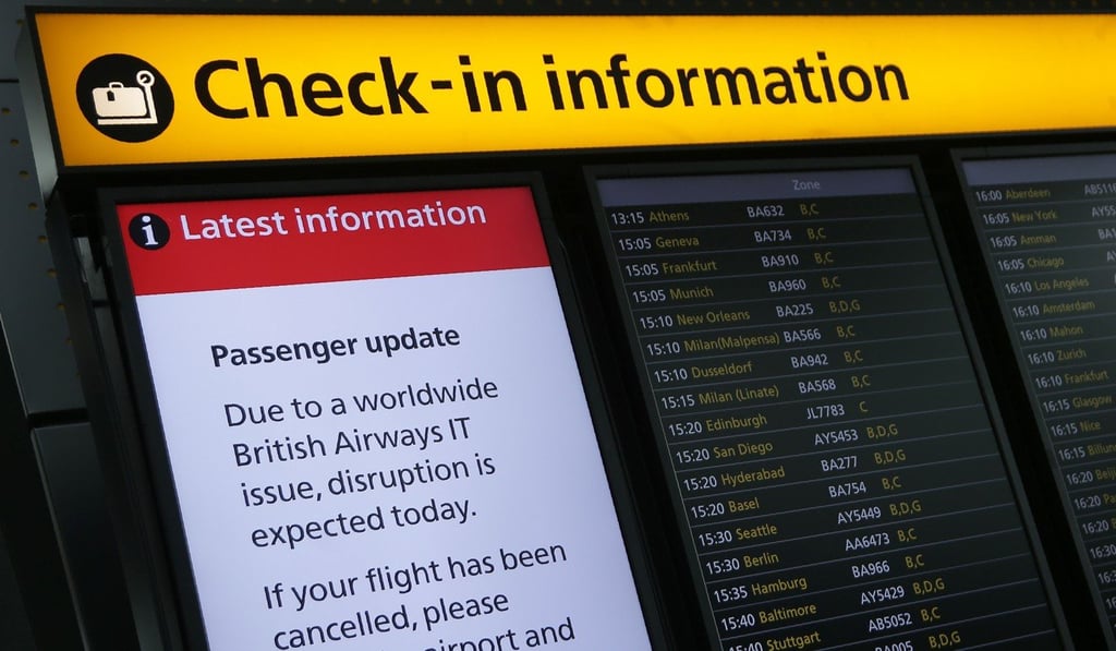A display warning passengers to expect disruptions to British Airways flights is pictured inside Terminal 5 of London's Heathrow Airport on Monday. Photo: AFP