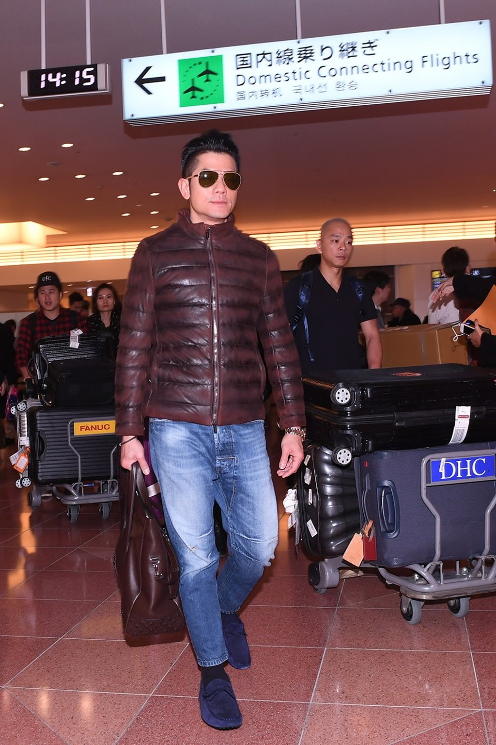 Aaron Kwok wearing TOD'S Gommino