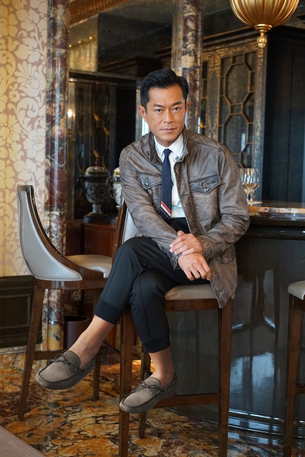 Louis Koo wearing TOD'S Gommino