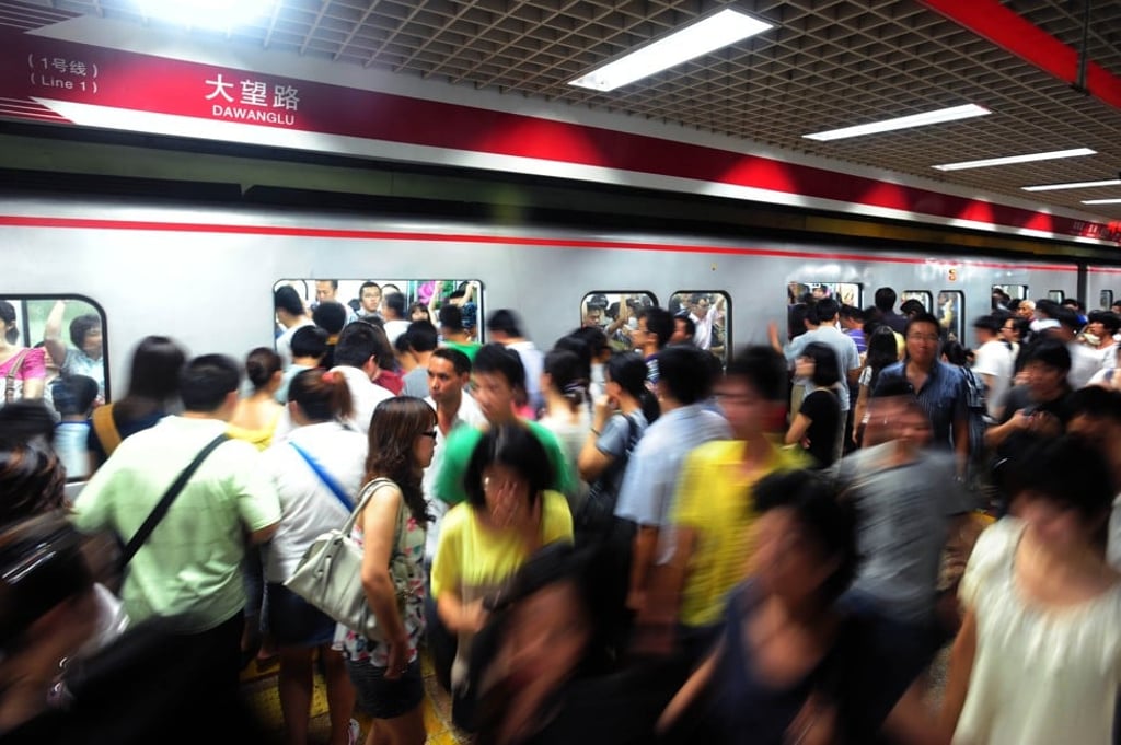 Beijing’s subway operator may adopt facial recognition technology to augment its security check points to reduce the long queues at its stations during rush hour. Photo: AFP
