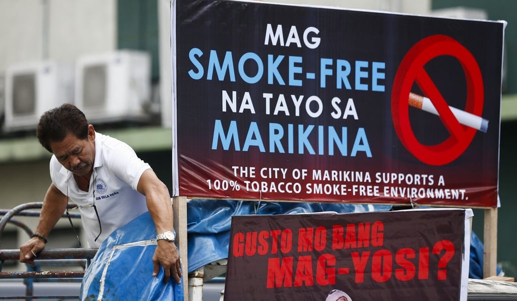 A municipal health worker prepares a truck to be used for an information campaign to encourage a smoke-free community, to mark World No Tobacco Day, in Marikina City, east of Manila, on May 31. Photo: EPA